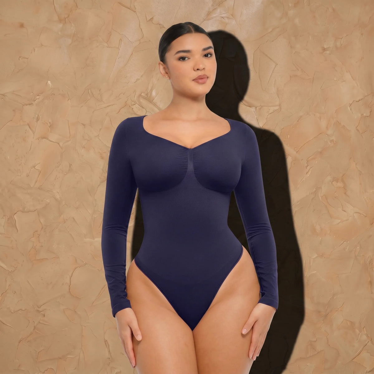 Vellure Paris Signature L'Amour — Sophisticated long-sleeve sculpting bodysuit featuring an elegant diamond neckline and a seamless thong silhouette for all-day comfort.