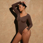 Vellure Paris Signature L'Amour — Sophisticated long-sleeve sculpting bodysuit featuring an elegant diamond neckline and a seamless thong silhouette for all-day comfort.