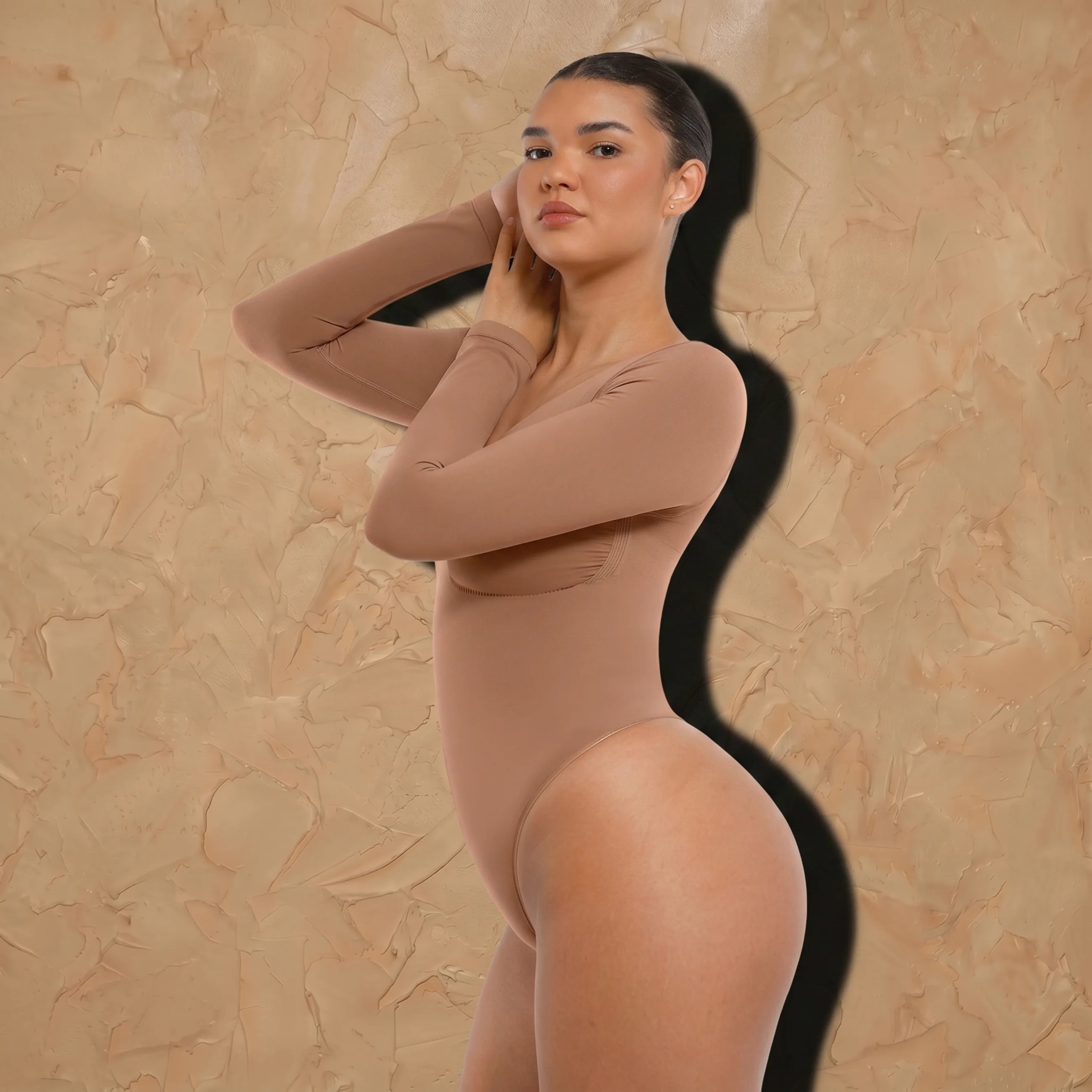 Vellure Paris Signature L'Amour — Sophisticated long-sleeve sculpting bodysuit featuring an elegant diamond neckline and a seamless thong silhouette for all-day comfort.