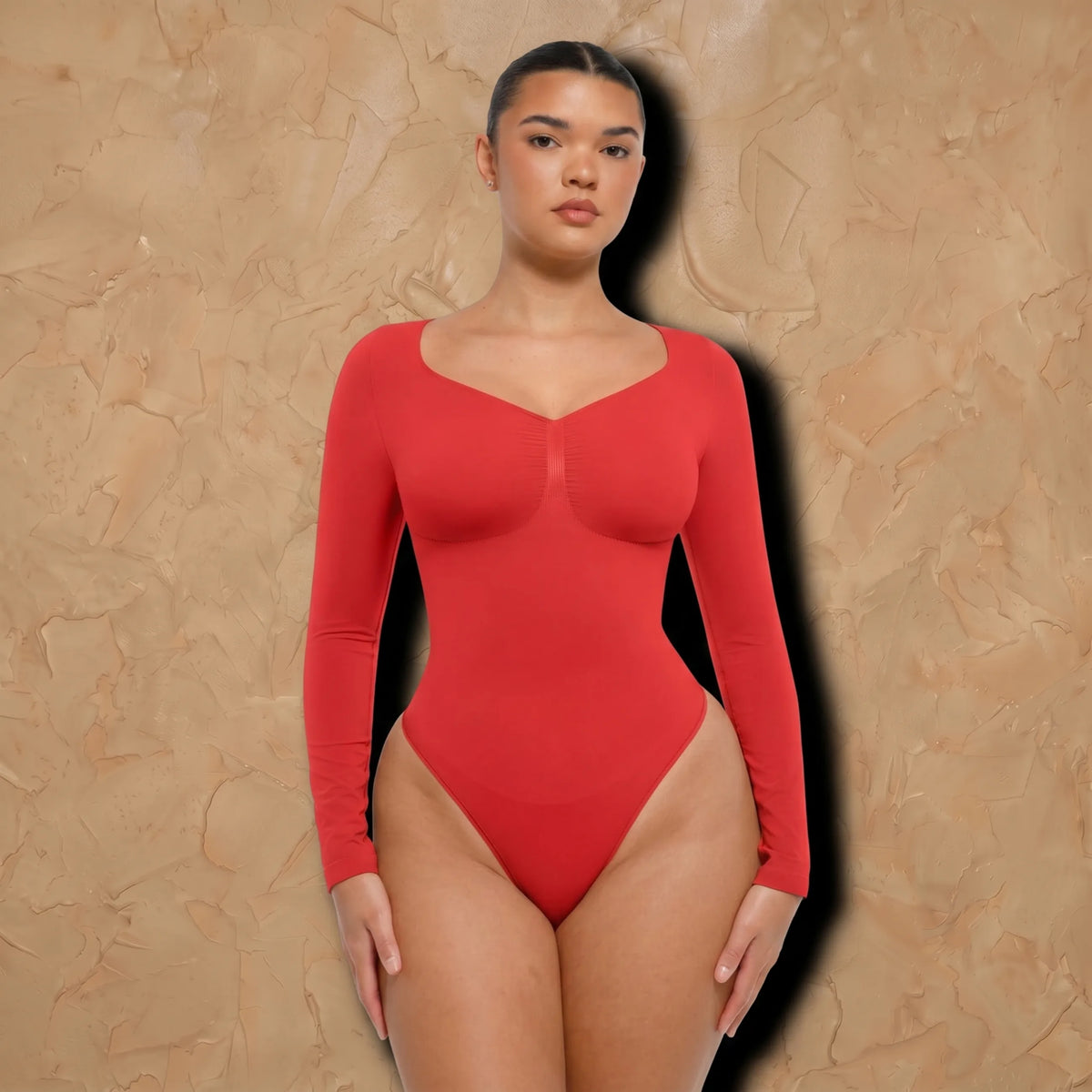 Vellure Paris Signature L'Amour — Sophisticated long-sleeve sculpting bodysuit featuring an elegant diamond neckline and a seamless thong silhouette for all-day comfort.