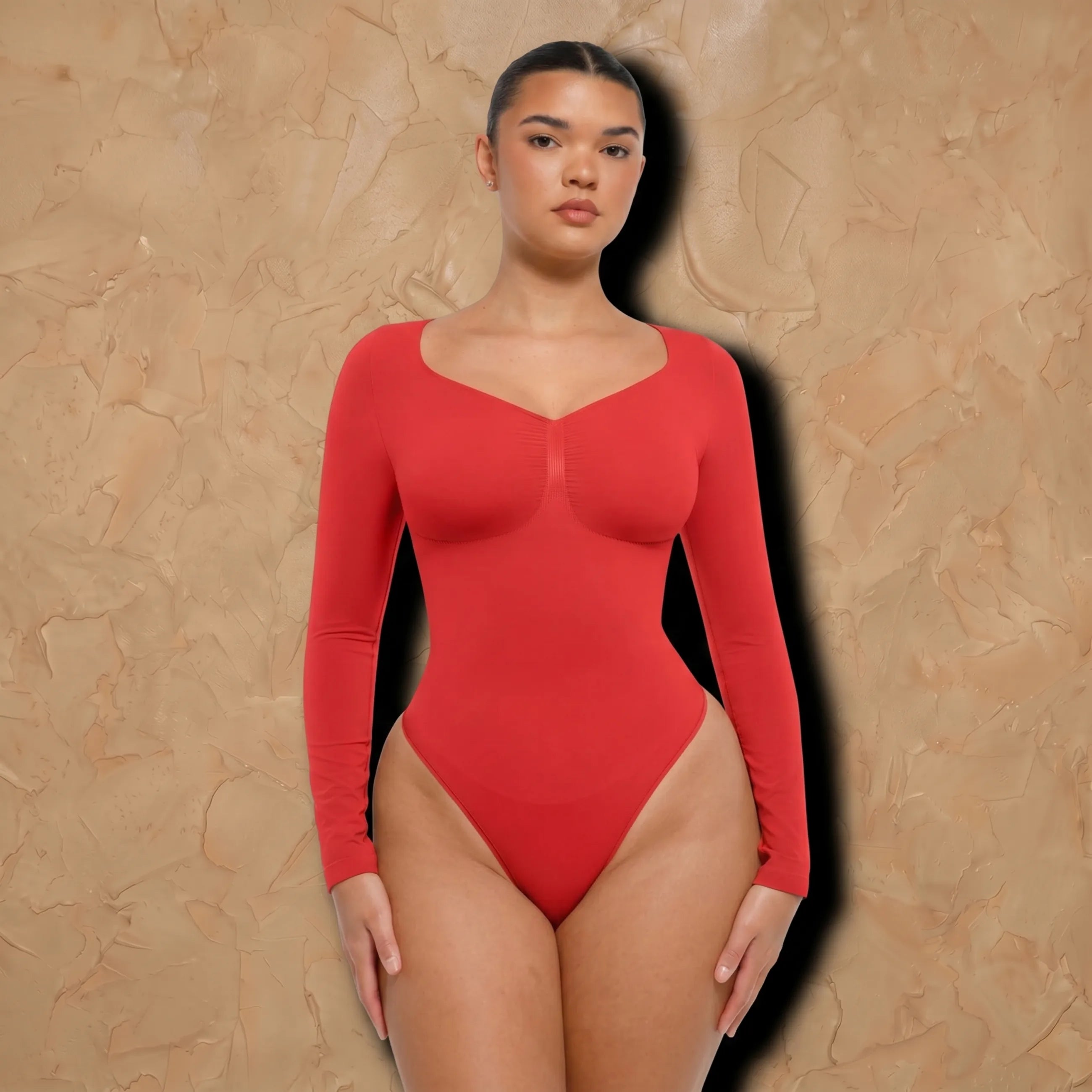 Vellure Paris Signature L'Amour — Sophisticated long-sleeve sculpting bodysuit featuring an elegant diamond neckline and a seamless thong silhouette for all-day comfort.