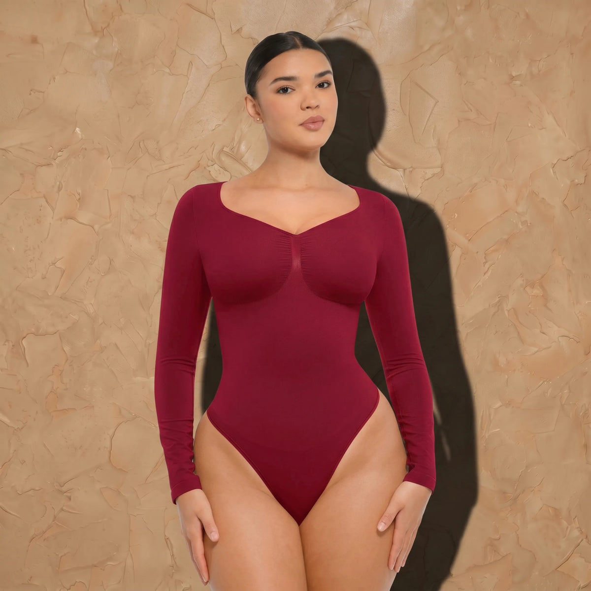Vellure Paris Signature L'Amour — Sophisticated long-sleeve sculpting bodysuit featuring an elegant diamond neckline and a seamless thong silhouette for all-day comfort.