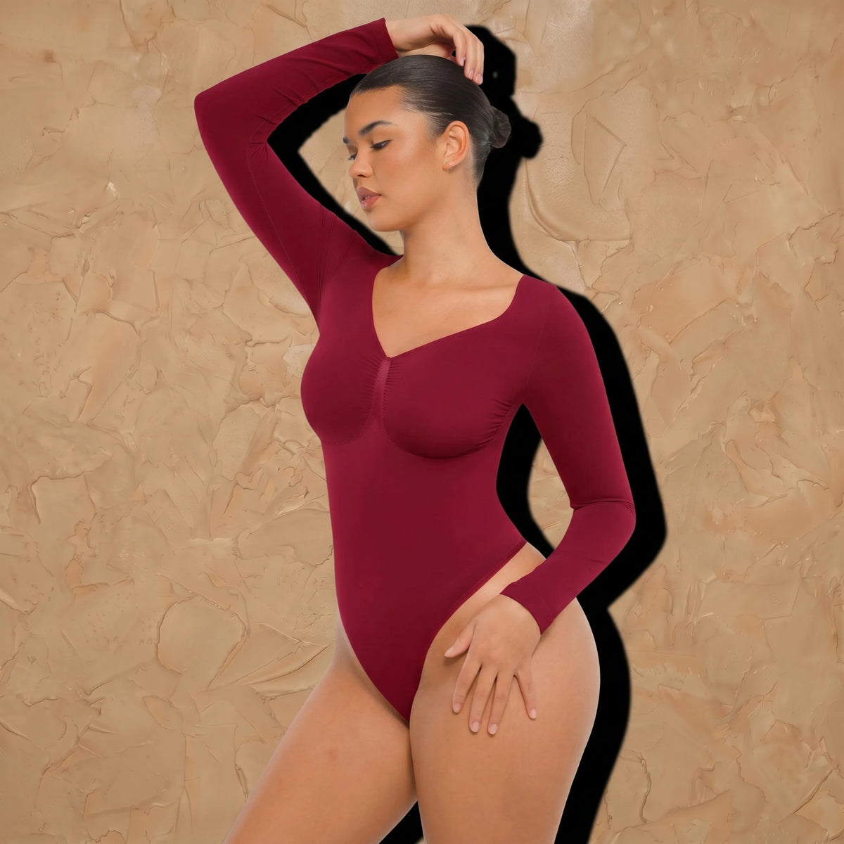Vellure Paris Signature L'Amour — Sophisticated long-sleeve sculpting bodysuit featuring an elegant diamond neckline and a seamless thong silhouette for all-day comfort.