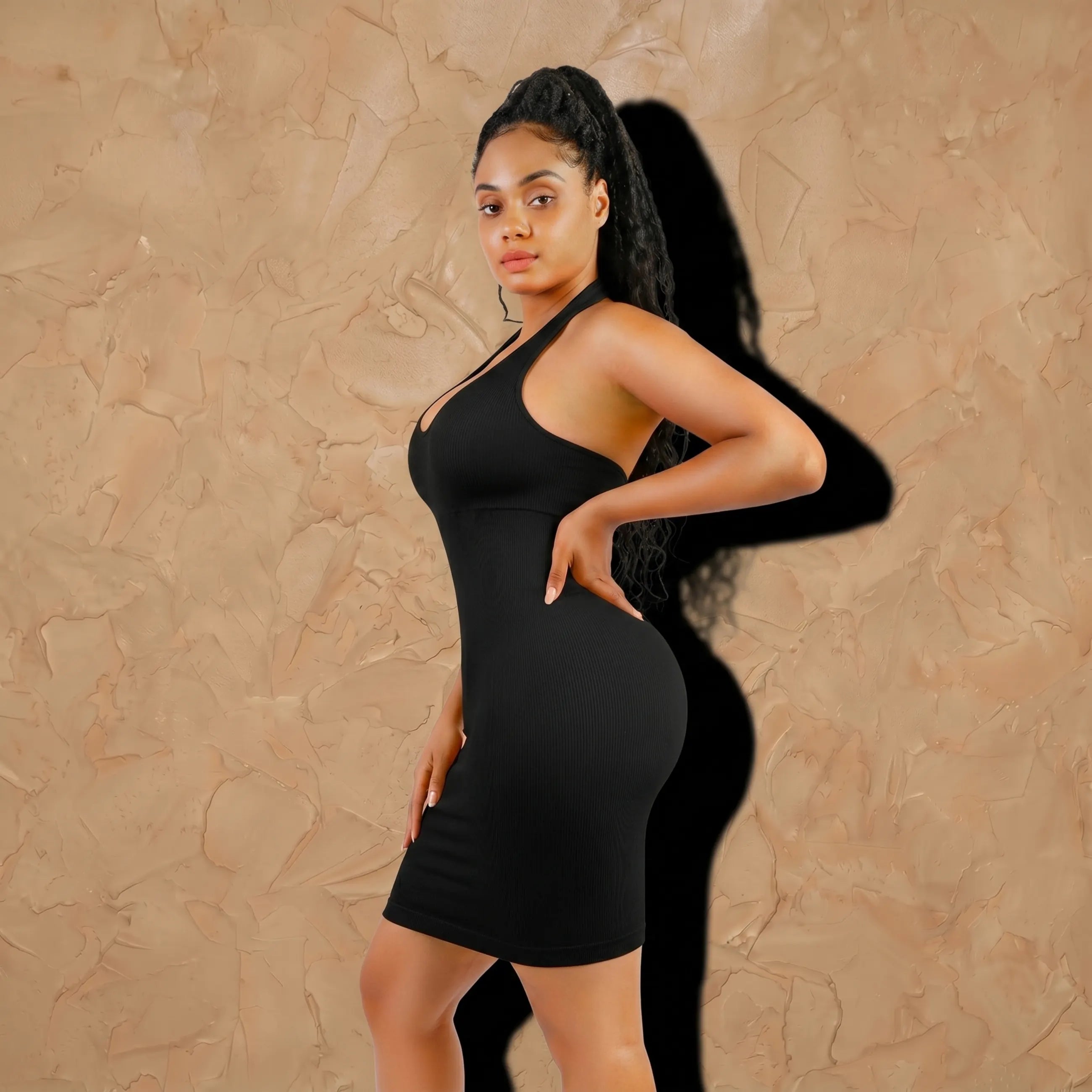 Vellure Paris L'Art du Contour — Eco-conscious seamless halter midi dress featuring a ribbed texture, open-back design, and 360° midsection compression.
