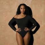 Vellure Paris Signature L'Asymétrie — Sustainable seamless bodysuit featuring a striking diagonal off-shoulder neckline, long sleeves, and a thong back design for an invisible finish.