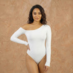 Vellure Paris Signature L'Asymétrie — Sustainable seamless bodysuit featuring a striking diagonal off-shoulder neckline, long sleeves, and a thong back design for an invisible finish.